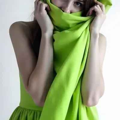 Caucasian Woman Age 25 With Brown Hair Partially Covered By A Vibrant Green Fabric In A Minimalist Gray And White Indoor Setting 18 0b9d