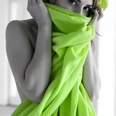 Caucasian Woman Age 25 With Brown Hair Partially Covered By A Vibrant Green Fabric In A Minimalist Gray And White Indoor Setting 21 2bab