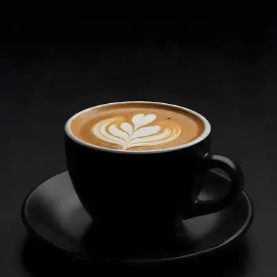 A Black Cup Of Coffee With Foam On A Black Plate Dark Background 7 F67d