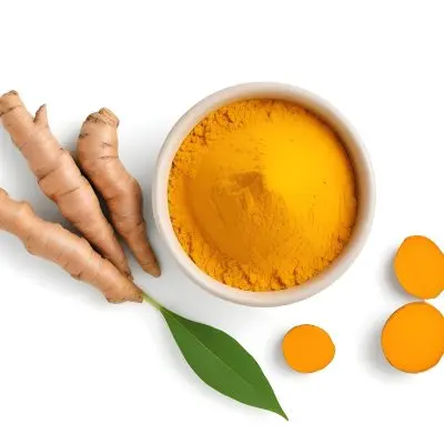 A Bowl Of Bright Yellow Turmeric Powder Surrounded By Fresh Turmeric Roots And Leaves 4 0ef6