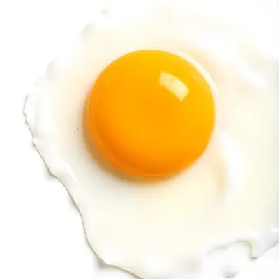 A Fried Egg With A Bright Yellow Yolk And Translucent White On A White Surface Top Down View Studio Lighting Food Photography 29 A648
