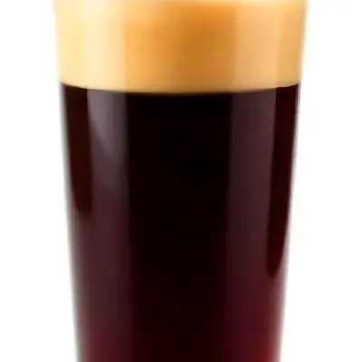 A Glass Of Dark Coffee With A Layer Of Light Brown Foam On Top Against A Plain White Background 9 0033