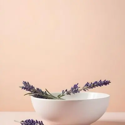 A White Ceramic Bowl With A Sprig Of Lavender On A Peach Colored Background Minimalist Composition Soft Lighting Clean Aesthetic Product Photography Product Shot 2 C1ca