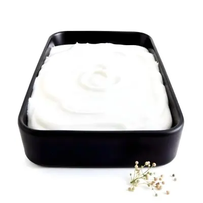 A White Square Plate With Rounded Corners Filled With White Liquid On A White Background 6 Cdf0