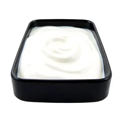 A White Square Plate With Rounded Corners Filled With White Liquid On A White Background 9 683b
