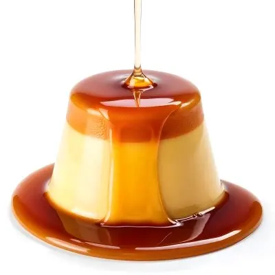 Caramel Flan With Caramel Syrup Being Poured On Top On A White Background 1 4f3c