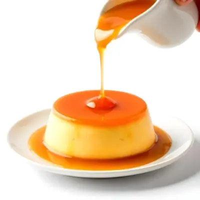 Caramel Flan With Caramel Syrup Being Poured On Top On A White Background 19 Fe51