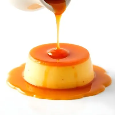 Caramel Flan With Caramel Syrup Being Poured On Top On A White Background 23 9615