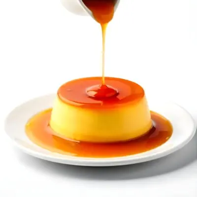Caramel Flan With Caramel Syrup Being Poured On Top On A White Background 24 C5a8