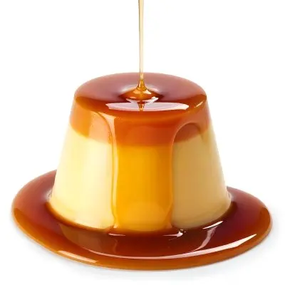 Caramel Flan With Caramel Syrup Being Poured On Top On A White Background 4 D292