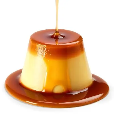 Caramel Flan With Caramel Syrup Being Poured On Top On A White Background 41 243f