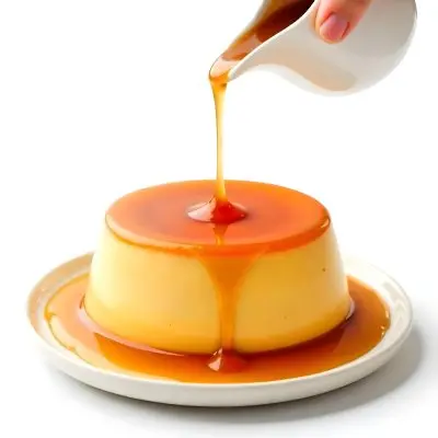 Caramel Flan With Caramel Syrup Being Poured On Top On A White Background 42 90e2