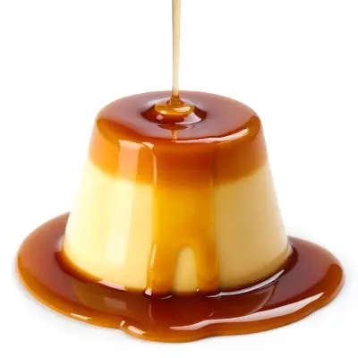 Caramel Flan With Caramel Syrup Being Poured On Top On A White Background 45 9517