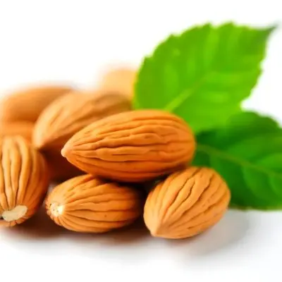 Pile Of Almonds With Green Leaves Close Up 12 5464