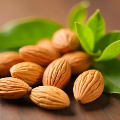 Pile Of Almonds With Green Leaves Close Up 4 15a8