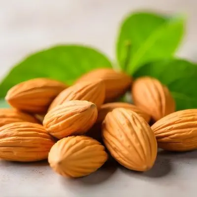 Pile Of Almonds With Green Leaves Close Up 6 21a5
