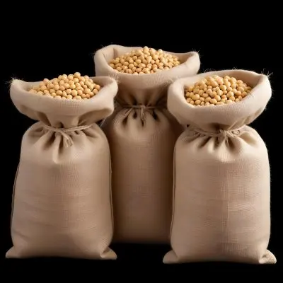 Three Jute Sacks Filled With Soybeans Tied With String Creating A Rustic And Textured Composition Against A Black Background 1 Bfbc