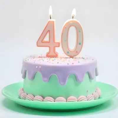 A Birthday Cake With Pastel Colors And Number 40 Candles On A Green Plate Light Purple And Green Frosting Plain White Background 16 Facc