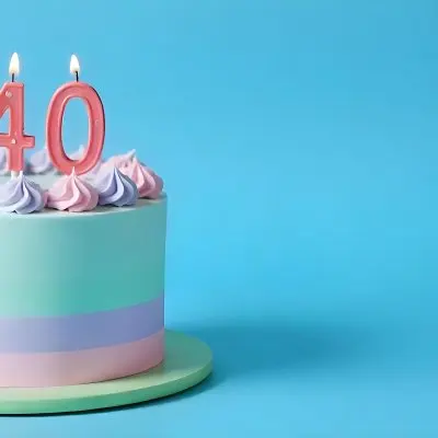 A Birthday Cake With Pastel Colors And Number 40 Candles On A Green Plate Light Purple And Green Frosting Plain White Background 17 3a07