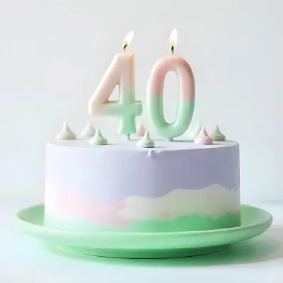 A Birthday Cake With Pastel Colors And Number 40 Candles On A Green Plate Light Purple And Green Frosting Plain White Background 5 546e