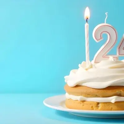 A Birthday Cake With White Frosting And A Candle In The Shape Of The Number 24 Light Blue Background 21 83ce