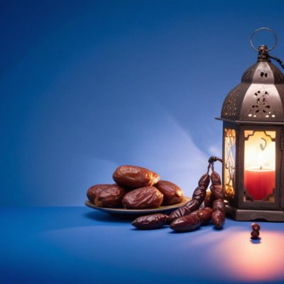 A Plate Of Dates And A String Of Prayer Beads Next To A Lantern On A Blue Background 33 A120