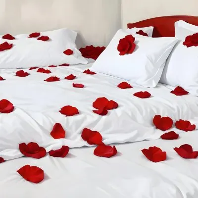 White Bed With Red Pillows And Sheets Covered With Red Rose Petals In A Bedroom 13 21d2