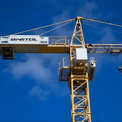 A Large Yellow Construction Crane Against A Bright Blue Sky 9 Fcb2