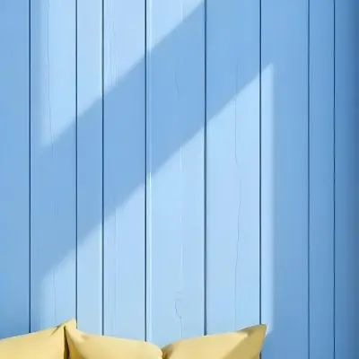 A Blue Wooden Wall With Vertical Planks A Cushions In The Foreground 13 6ee2