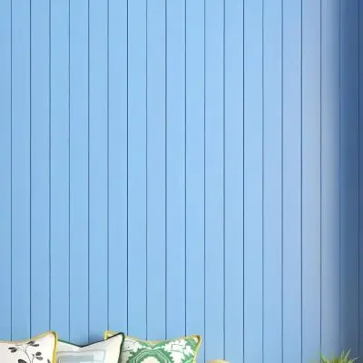 A Blue Wooden Wall With Vertical Planks A Cushions In The Foreground 3 C2b2