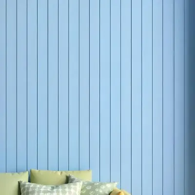 A Blue Wooden Wall With Vertical Planks A Cushions In The Foreground 5 2dcf