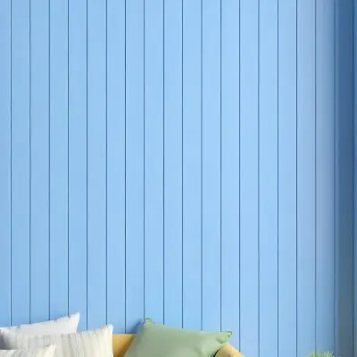 A Blue Wooden Wall With Vertical Planks A Cushions In The Foreground 8 0da1