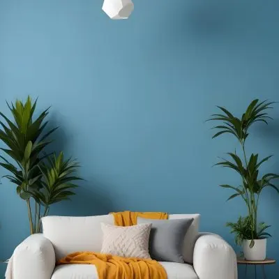 A Modern Living Room With A White Sofa A Potted Plant And Geometric Pendant Lights Hanging From The Ceiling Against A Blue Wall 11 E655