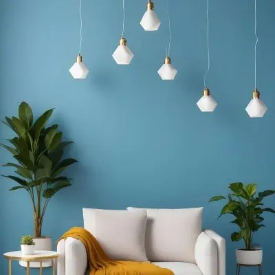 A Modern Living Room With A White Sofa A Potted Plant And Geometric Pendant Lights Hanging From The Ceiling Against A Blue Wall 29 0e4b