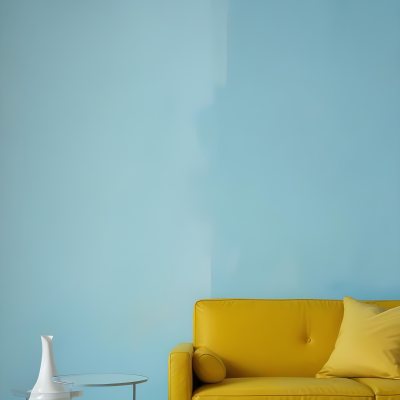 A White Sofa With A White Pillow A Yellow Vase And A Glass On A Table In Front Of A Yellow Wall 18 5bbc