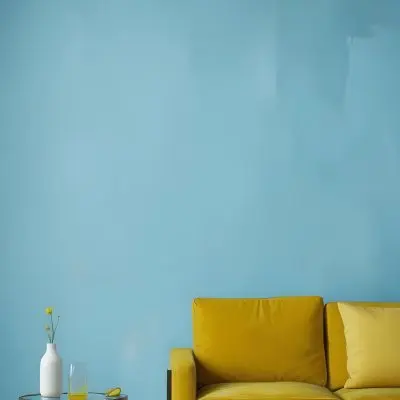 A White Sofa With A White Pillow A Yellow Vase And A Glass On A Table In Front Of A Yellow Wall 25 Fb6a