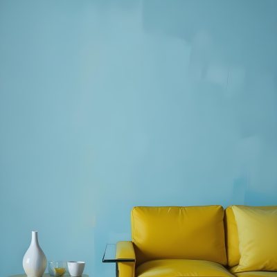 A White Sofa With A White Pillow A Yellow Vase And A Glass On A Table In Front Of A Yellow Wall 36 C9b1