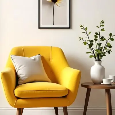 Yellow Armchair With A Flower Pillow Next To A Wooden Table With A Vase Of White Flowers A Cup Of Tea And A Candle With A Yellow Wall And A Framed Picture In The Background 22 244d