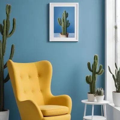 Yellow Armchair With A White Frame On The Wall And A White Table With Cactuses In A Blue Room 1 2546