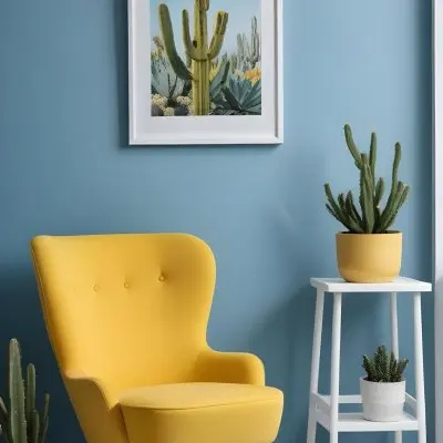 Yellow Armchair With A White Frame On The Wall And A White Table With Cactuses In A Blue Room 16 136a