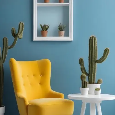 Yellow Armchair With A White Frame On The Wall And A White Table With Cactuses In A Blue Room 20 7f21