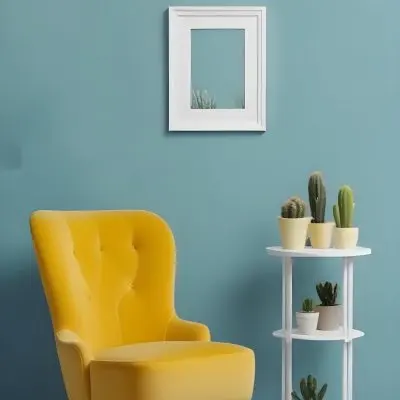 Yellow Armchair With A White Frame On The Wall And A White Table With Cactuses In A Blue Room 23 9b22
