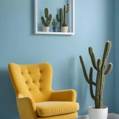 Yellow Armchair With A White Frame On The Wall And A White Table With Cactuses In A Blue Room 31 80d7