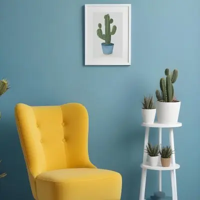 Yellow Armchair With A White Frame On The Wall And A White Table With Cactuses In A Blue Room 33 8d73