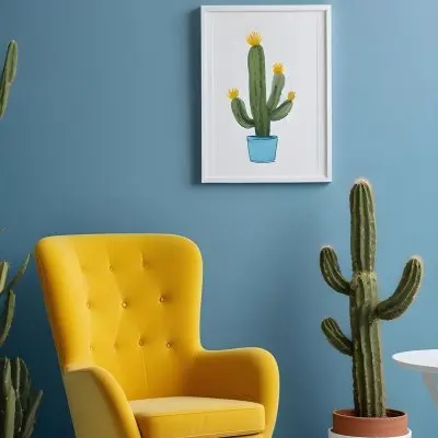 Yellow Armchair With A White Frame On The Wall And A White Table With Cactuses In A Blue Room 5 9d53