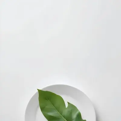 A Green Leaf On A White Plate Minimalist Composition Clean And Bright Aesthetic Soft Lighting White Background Nature Inspired Simple And Elegant Fresh And Organic 10 2c7a