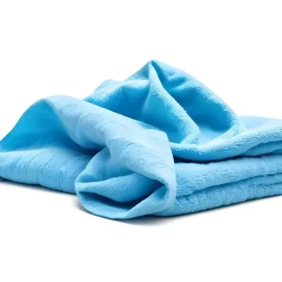 A Light Blue Towel Terrycloth Texture Folded And Crumpled