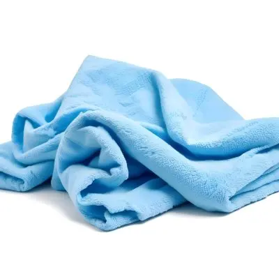 A Light Blue Towel Terrycloth Texture Folded And Crumpled Soft And Absorbent For Drying Or Cleaning On A White Background 4 6bb9