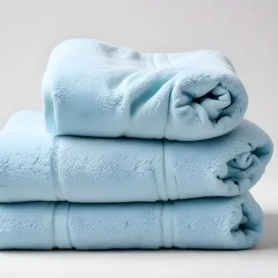 A Light Blue Towel Terrycloth Texture Folded And Crumpled Soft And Absorbent For Drying Or Cleaning On A White Background 6 874d