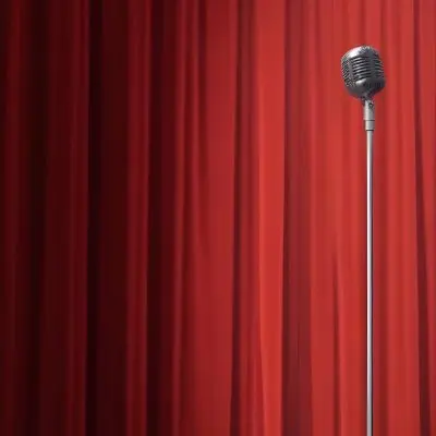 A Microphone On A Stage With Red Curtains In The Background 34 879d